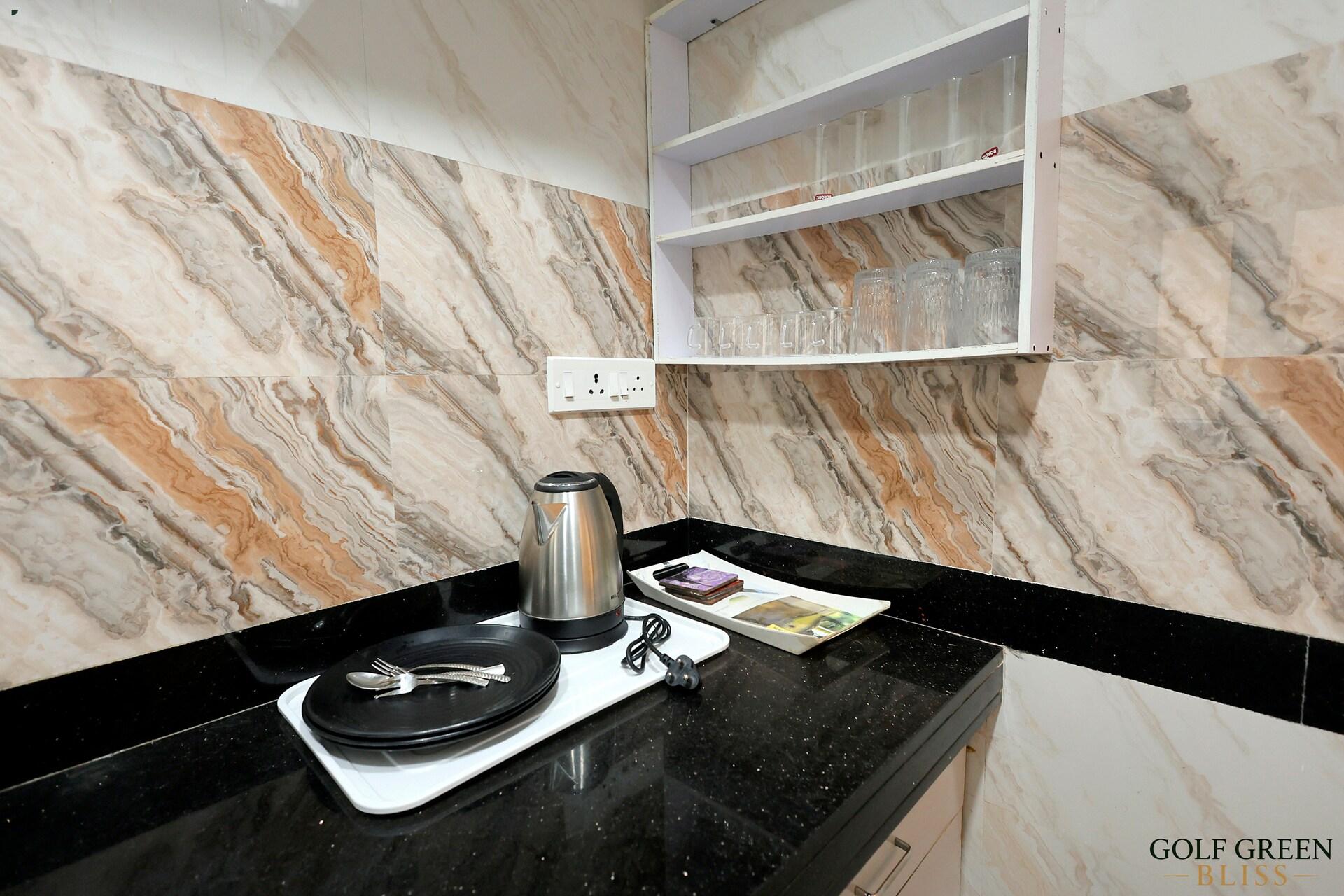 An electric kettle on the kitchen's granite worktop